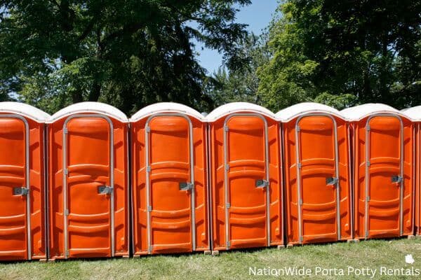 a lineup of clean and well-maintained portable loos for workers in Texas