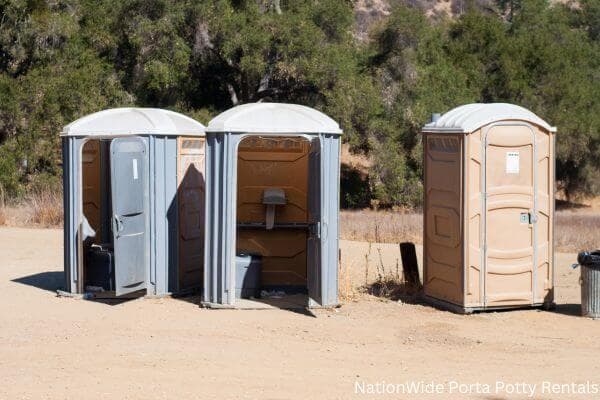 a clean row of portable restrooms for outdoor weddings or festivals in Harleton, TX